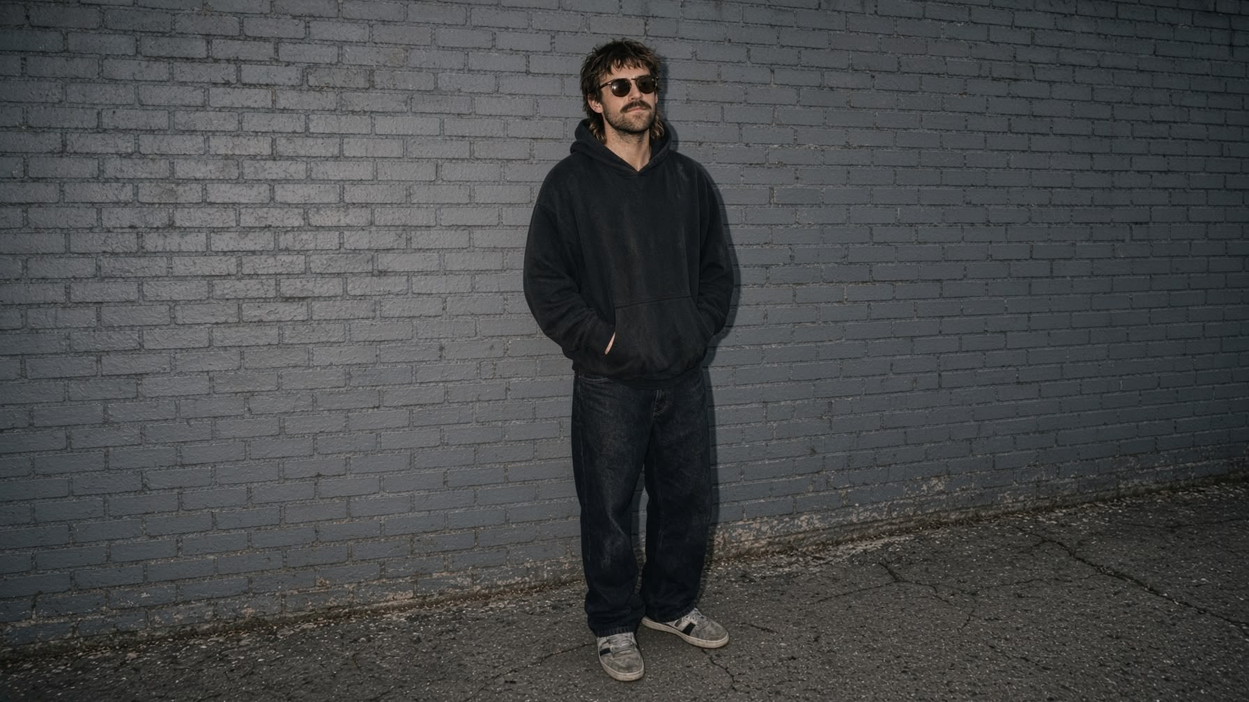 Teags in front of a brick wall